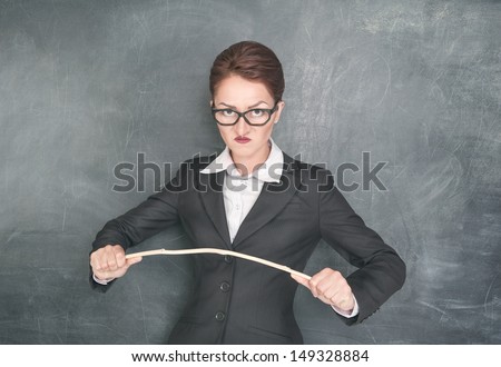 http://thumb1.shutterstock.com/display_pic_with_logo/649624/149328884/stock-photo-angry-teacher-in-glasses-with-wooden-stick-149328884.jpg