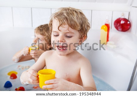 older bdsm slaves girl and boy bathing together