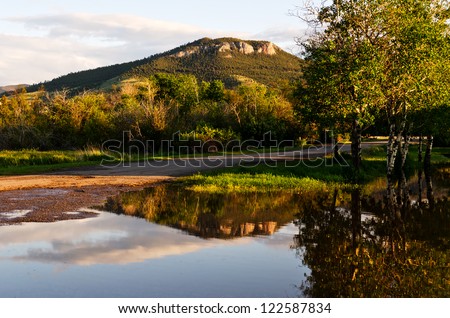  - stock-photo-mount-helena-can-be-seen-from-many-parts-of-helena-montana-this-reflection-is-not-a-normal-one-122587834