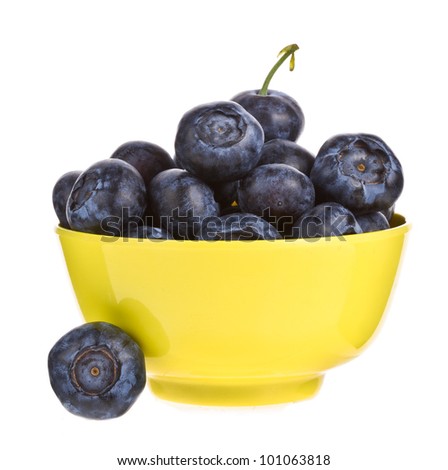 Raspberry in a wooden bowl isolated on a white background