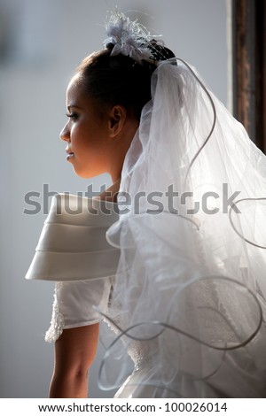 http://thumb1.shutterstock.com/display_pic_with_logo/757423/100026014/stock-photo-beautiful-bride-lit-up-from-light-showering-her-from-the-open-window-100026014.jpg