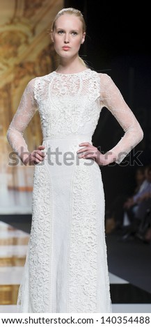  - stock-photo-barcelona-may-a-model-walks-on-the-yolan-cris-catwalk-during-the-barcelona-bridal-week-runway-140354488