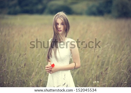http://thumb1.shutterstock.com/display_pic_with_logo/799939/152045534/stock-photo-beautiful-young-girl-with-a-flower-152045534.jpg