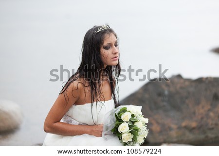 http://thumb1.shutterstock.com/display_pic_with_logo/834856/108579224/stock-photo-sad-bride-sitting-on-the-sea-shore-and-crying-in-the-rain-108579224.jpg