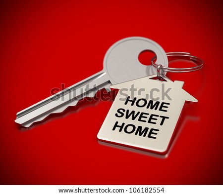 home sweet home written onto a metal keyring, home shape. metallic key home sweet home written onto a metal keyring, home shape. metallic key