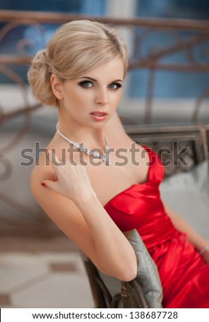 stock photo beautiful blonde sexy woman in red dress beauty jewelry model slim girl with makeup hairstyle 138687728