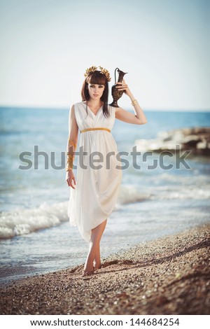 stock photo alluring woman in greek goddess style beautiful girl in sea water fantasy mermaid ocean outdoors 144684254