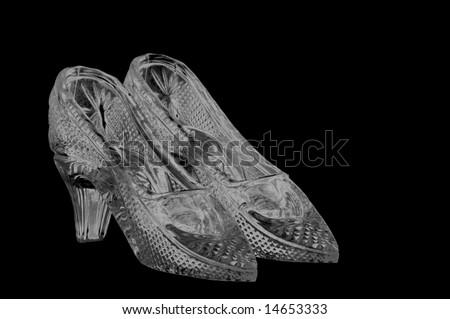 woman glass shoes isolated on black background - stock photo