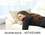 stock-photo-tired-executive-sleeping-lying-on-a-sofa-in-the-living-room-at-home-after-work-457431484.jpg