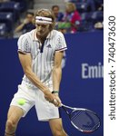 Small photo of NEW YORK - AUGUST 28, 2017: Professional tennis player Alexander Zverev of Germany in action during his 2017 US Open first round match at Billie Jean King National Tennis Center