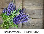 beautiful lupines on wooden...