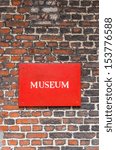 red museum sign attached to a...
