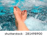 feet of a woman relaxing in a...