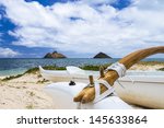 an outrigger canoe sits at the...