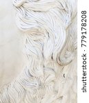 Small photo of White stucco moulding plasterwork spiral abstract pattern background.