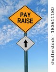 Small photo of pay raise ahead road sign over blue sky with clouds