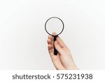 Small photo of Search through a magnifying glass, magnifying glass on a white background.