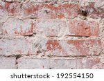 Small photo of Textured old red wall of brick with traces of rubbing