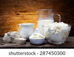 Small photo of fresh milk products on wooden background