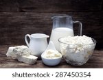 Small photo of fresh milk products on wooden background