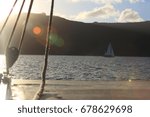 sailboat cruising on calm water ...