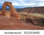 delicate arch at sunset in...