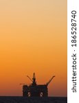 oil platform silhouette in gulf ...