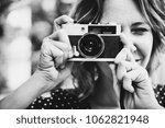 Small photo of Woman talking picture with camera