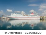 a large ferry ship moored in...