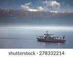 boat in the lake with fog  ...
