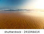 sandy beach and blue sea with...