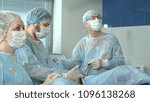 Small photo of Medical staff in the opearing room doing sucessful surgical procedure