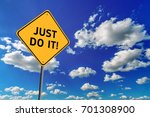 Small photo of Background of blue sky with cumulus clouds and yellow road sign with text Just Do It!