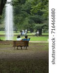 Small photo of You and me. Japanese couple in the Yoyogi park. Famous park in Tokyo, Japan.