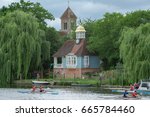 Small photo of Wallingford, UK. 24th June 2017. Canoe boats pass along the River Thames at Wallingford in South Oxfordshire on a warm summer's day