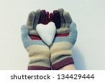snow heart in hands. closeup...
