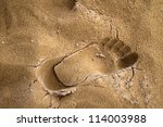 footprint on the sand with...