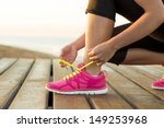 Young woman is running in sunny nature - stock photo