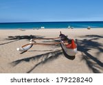 red and white outrigger at...