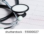 Stethoscope on a real EKG - stock photo