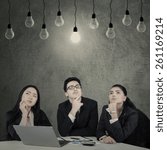 Small photo of Portrait of three multi ethnic businesspeople with thinking expression to find the solution