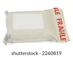 Small photo of A padded mailbag sealed with a fragile tape, with blank address label