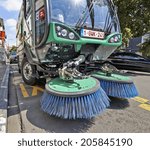 Small photo of BRUSSELS, BELGIUM - JULY 17, 2014: Process of urban street cleaning. Municipal machanical truck at Square du Chatelain in Ixelles on July 17 in Brussels.