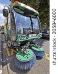 Small photo of BRUSSELS, BELGIUM - JULY 17, 2014: Process of urban street cleaning. Municipal mechanical truck at Square du Chatelain in Ixelles on July 17 in Brussels.