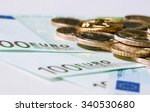 euro banknotes and coins on...