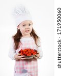 Small photo of A young girl uses fresh tomatoes to make something good to eat.
