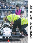 Small photo of HOCKENHEIM, GERMANY - AUGUST 2, 2015: Officials and Scrutineers check the safety and regulations of the FS Team Delft car, prior to the start of the endurance race of the officious world championships