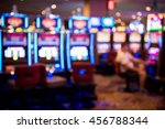 stock-photo-blurry-image-of-slots-machines-at-the-casino-456788344.jpg