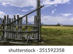 Small photo of Jackson, Wyoming, USA. Early Mormon homestead and rotten fence set against the Grand Tetons Mountains and in the middle of the prairie at Mormon Row, near Jackson, Wyoming, USA.