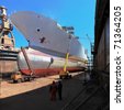 QUELS SONT CES NAVIRES ? - Page 48 Stock-photo-a-large-cargo-ship-is-being-renovated-in-shipyard-gdansk-poland-71364205